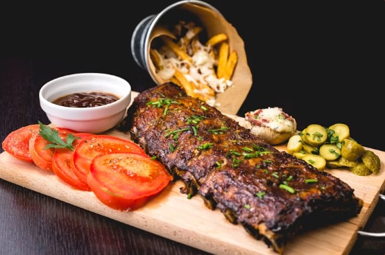 Preparación de carne al fuego